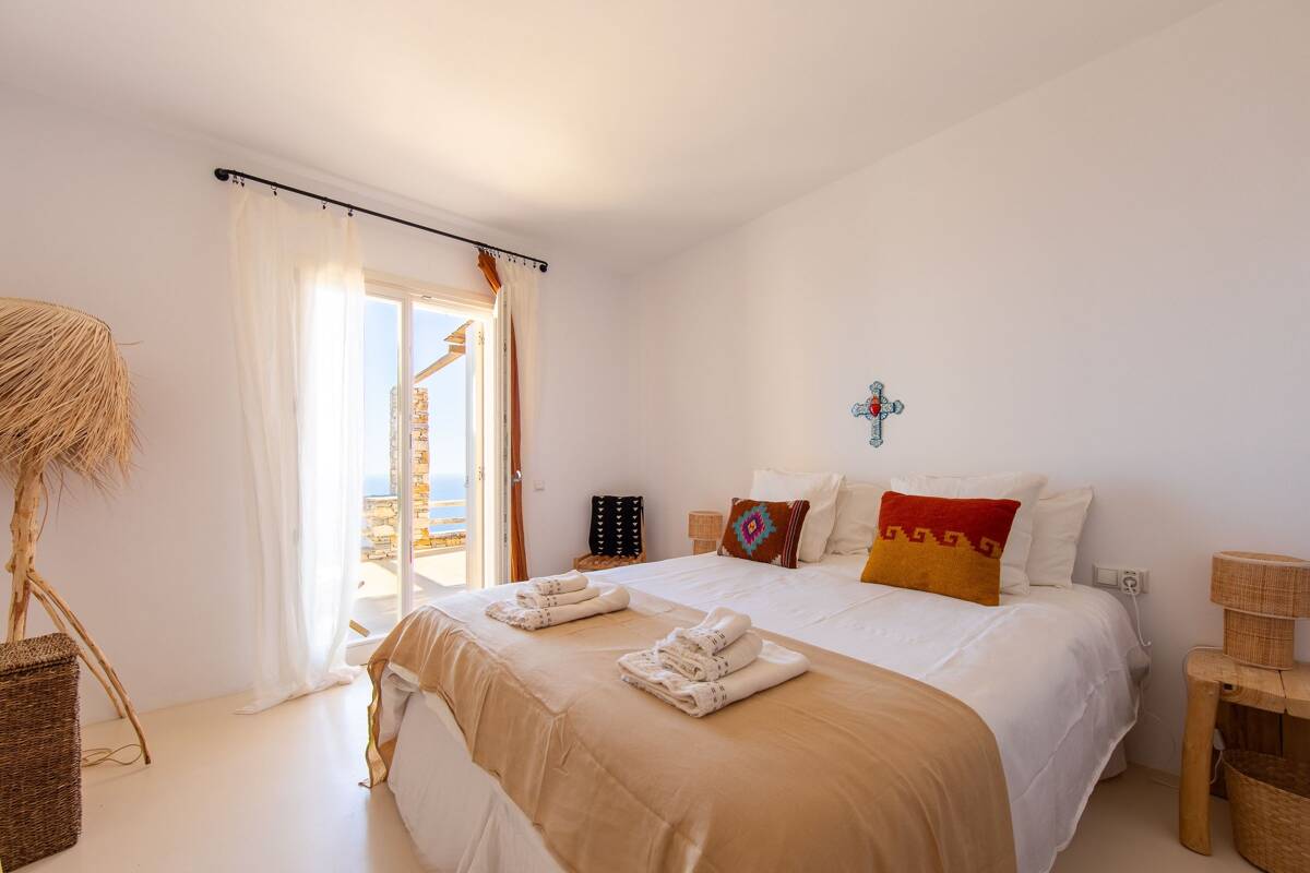 Bedroom in pale wood and white walls