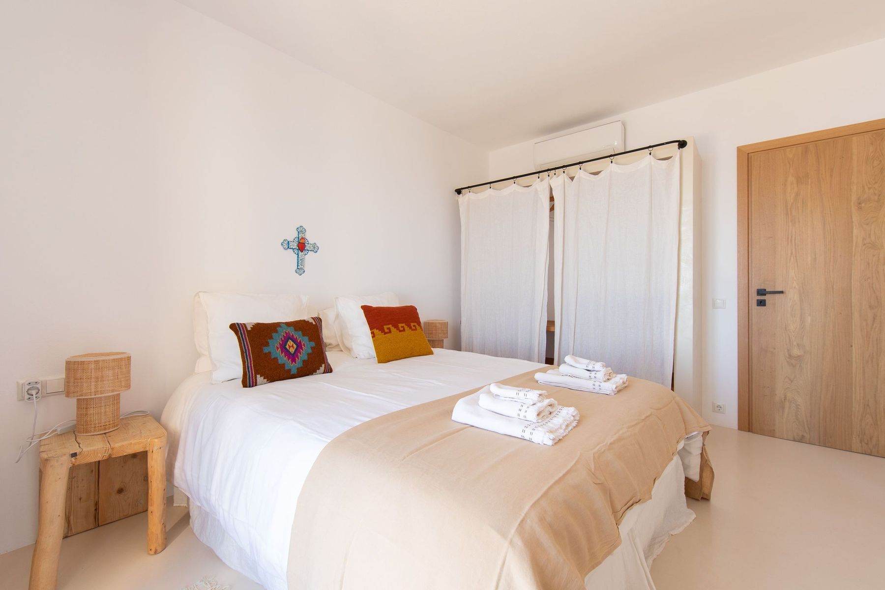 Bedroom with terracotta cushions