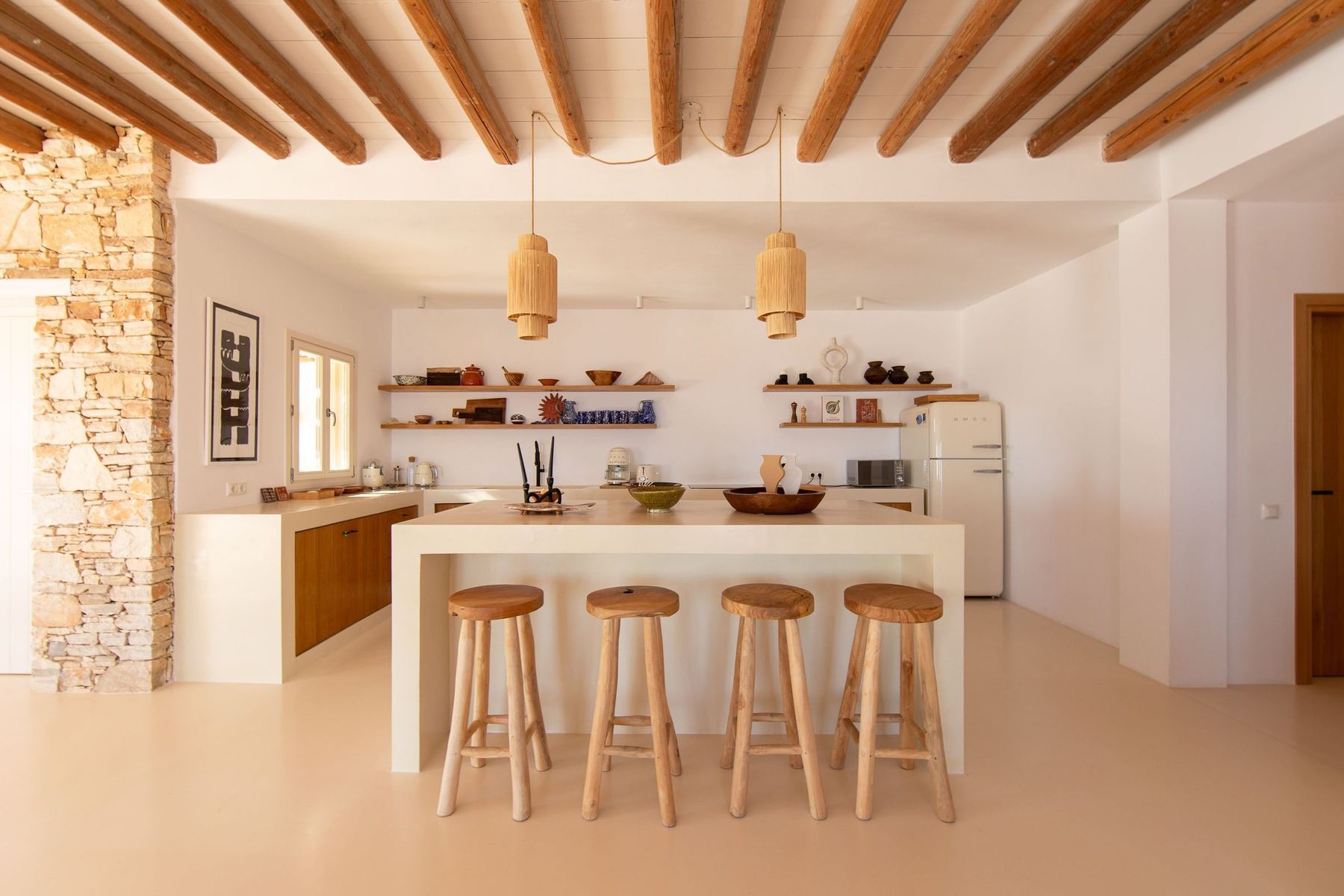 The kitchen island and its four stools