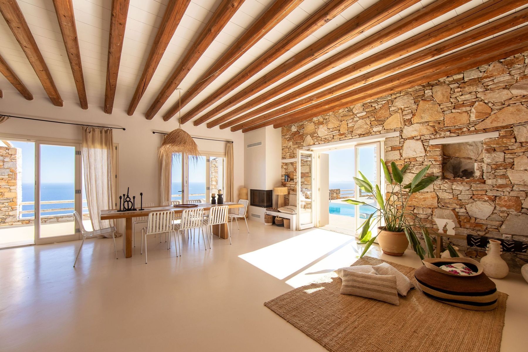 The open living room under wooden beams