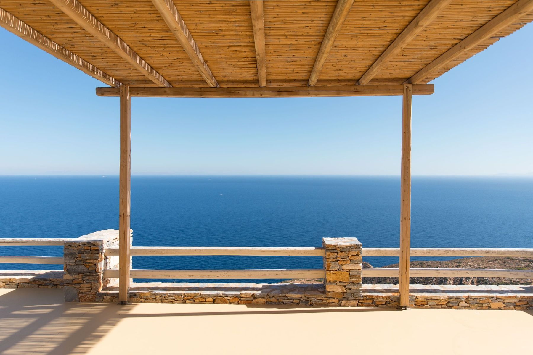 A pergola framing nothing but sea