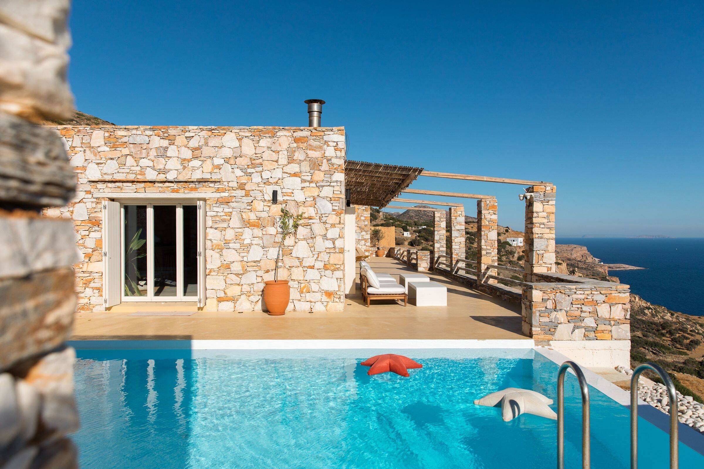 Villa Avlaki seen from the cliff at golden hour